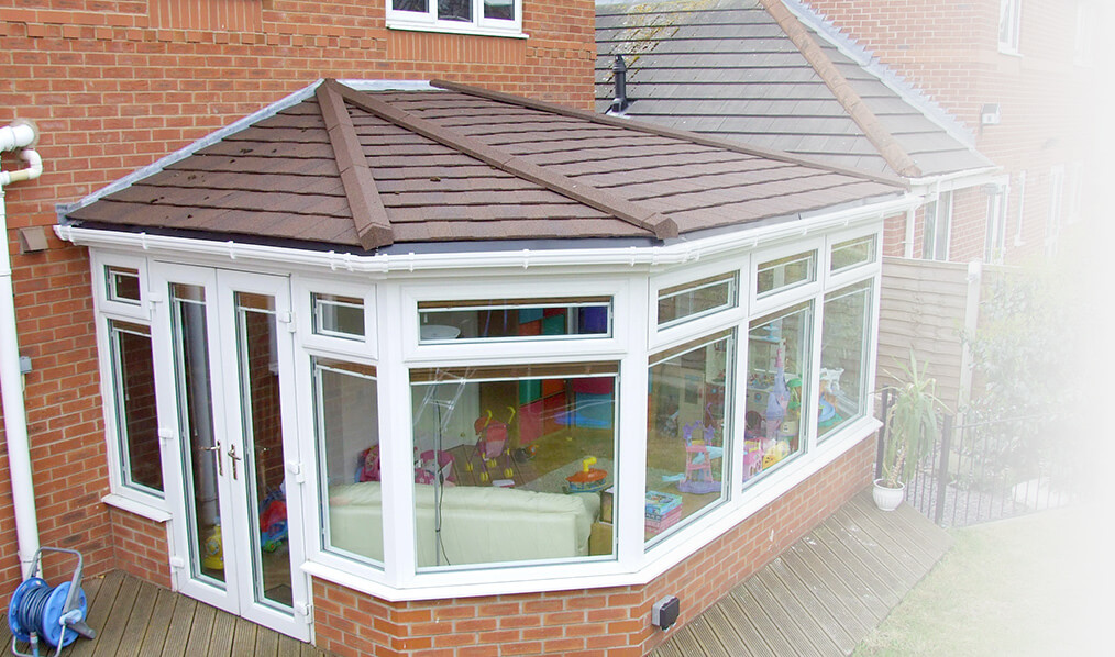 Large Victorian brown tiled conservatory roof